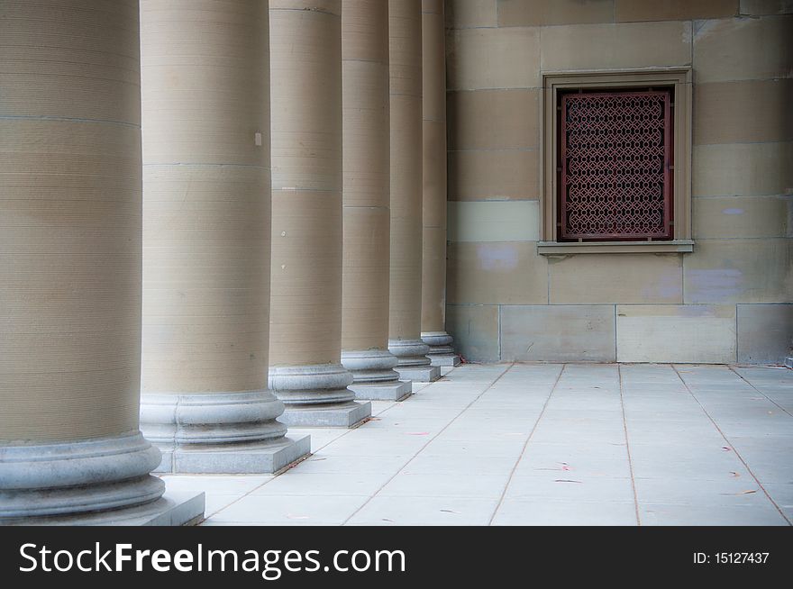 Columns and stonework featuring a grilled window. Columns and stonework featuring a grilled window.