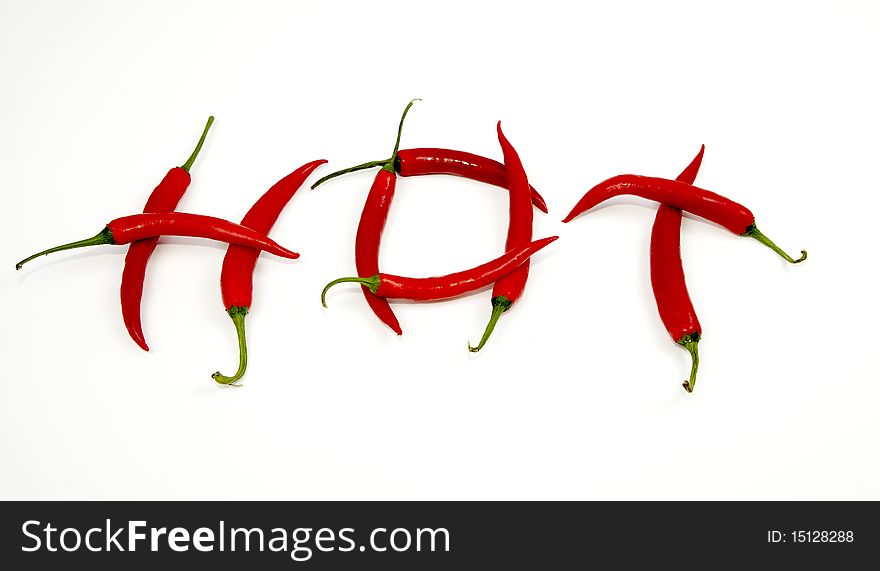 Red Chillis forming the Word Hot isolated on white. Red Chillis forming the Word Hot isolated on white