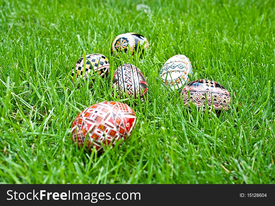 Beautifully colored easter eggs on grass