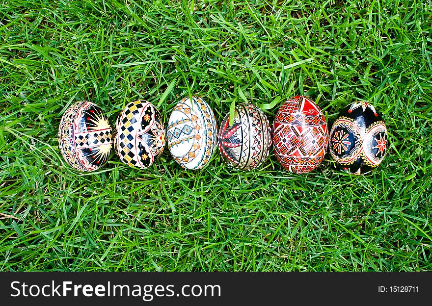 Beautifully colored easter eggs on grass