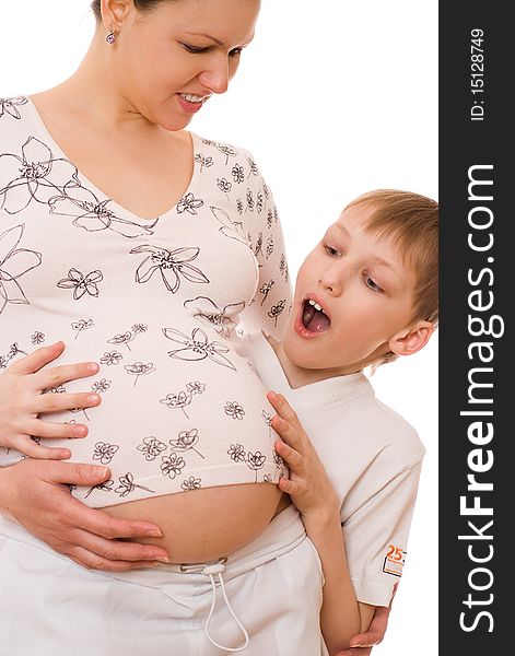 Son hugging his pregnant mothers stomach on a white. Son hugging his pregnant mothers stomach on a white