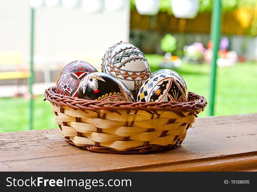 Beautifully colored easter eggs in a basket. Beautifully colored easter eggs in a basket