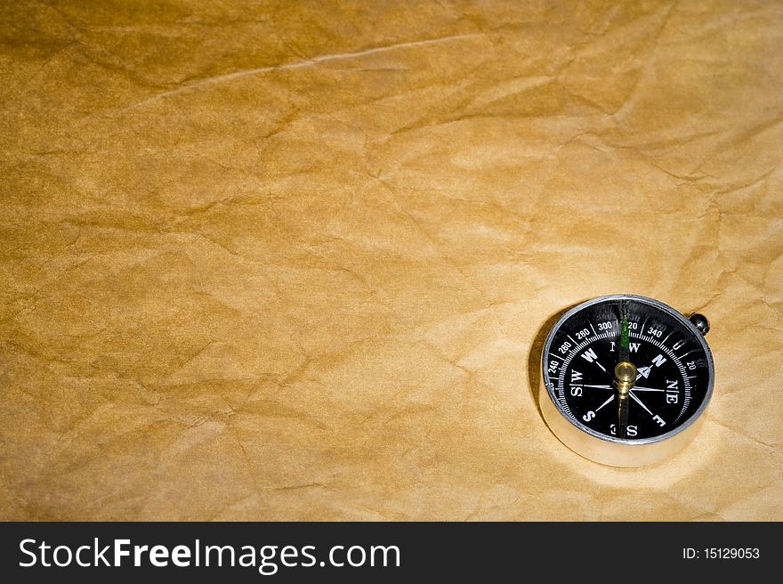 Texture old paper and compass . Brown background