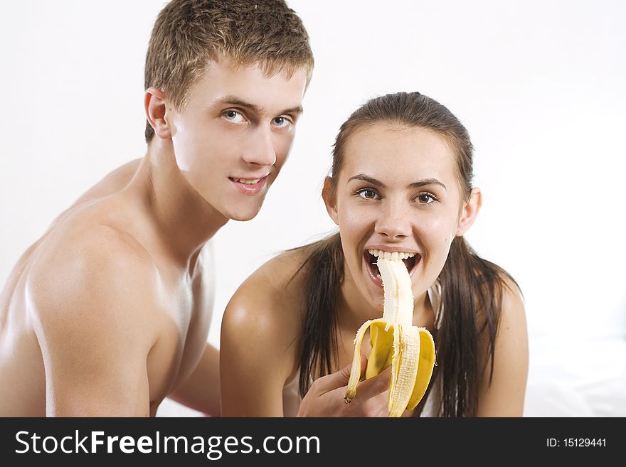 heterosexual couple eating banana
