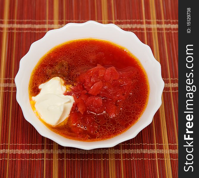 Bowl of soup with beets and cream