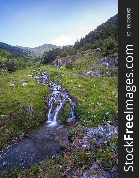 The last melting snow of the early Andorran summer flows down the steep mountains in fast and wild rivulets and creeks. The last melting snow of the early Andorran summer flows down the steep mountains in fast and wild rivulets and creeks.