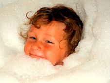Boy Face Surrounded By Bubbles In A Bath Stock Photo