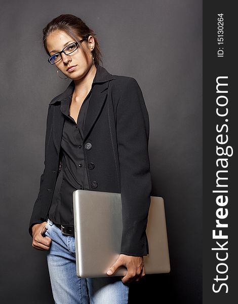 Girl with a computer in a black