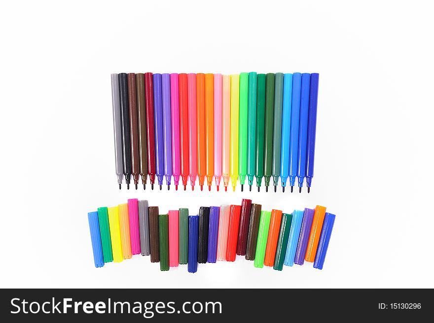 Arranged colorful tip-pen markers isolated on white background