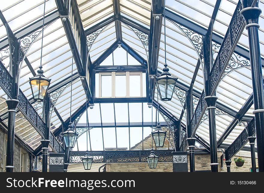 An image of the roof of a covered market made of glass and metal and allowing a bright interior and useful in bad weather. An image of the roof of a covered market made of glass and metal and allowing a bright interior and useful in bad weather.