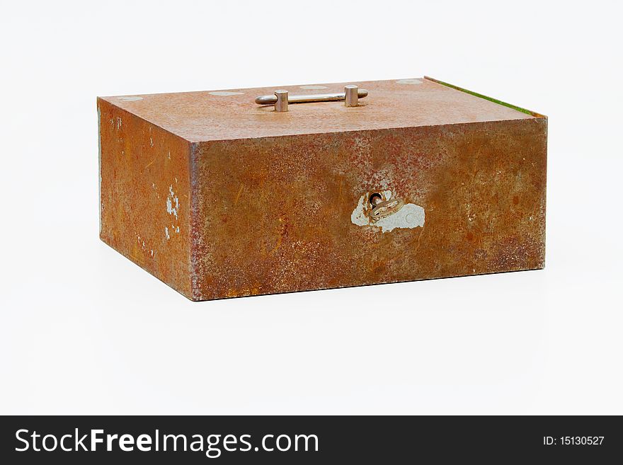 An old rusty cash box on a light background. An old rusty cash box on a light background