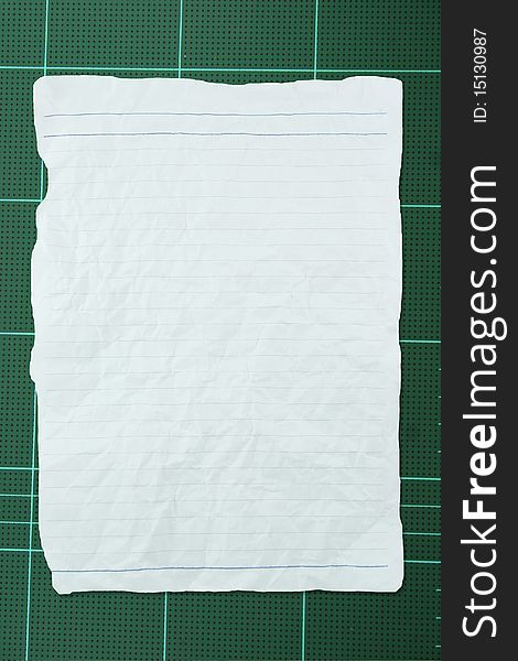 Tear white crumpled paper with line on green background. Tear white crumpled paper with line on green background