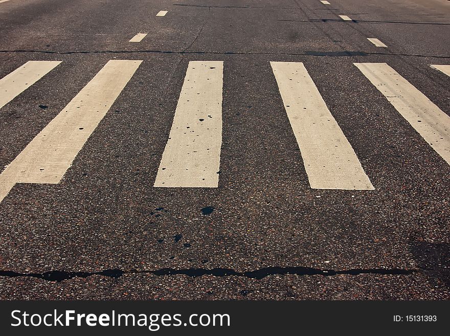 Pedestrian crossing on road at day