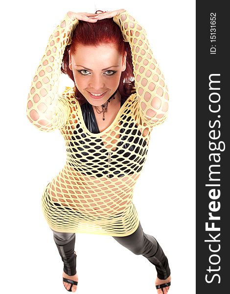 Young beautiful fashion model with red hair and a fishnet shirt. Young beautiful fashion model with red hair and a fishnet shirt.