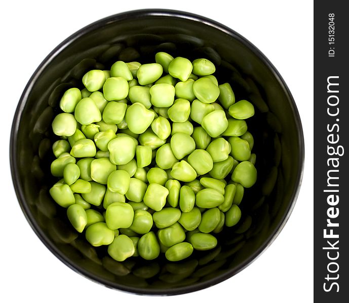 Fresh green peas in a beautiful black plate. Fresh green peas in a beautiful black plate