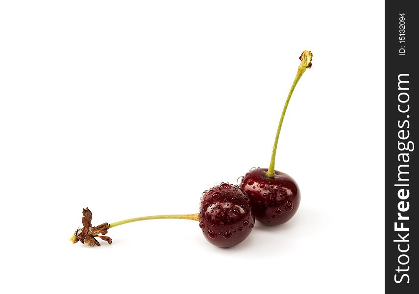 Two cherries on the white background