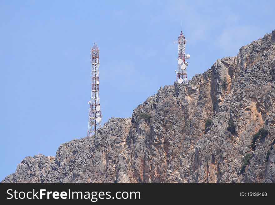 Gsm antenna on rocks on high mountain in summer