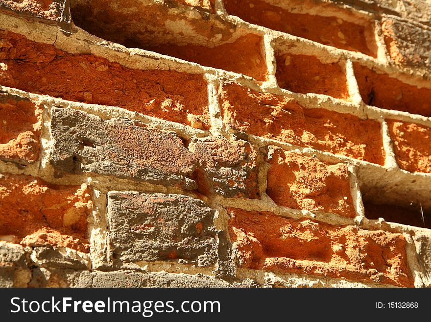 Brick wall of an ancient building in close up - background. Brick wall of an ancient building in close up - background