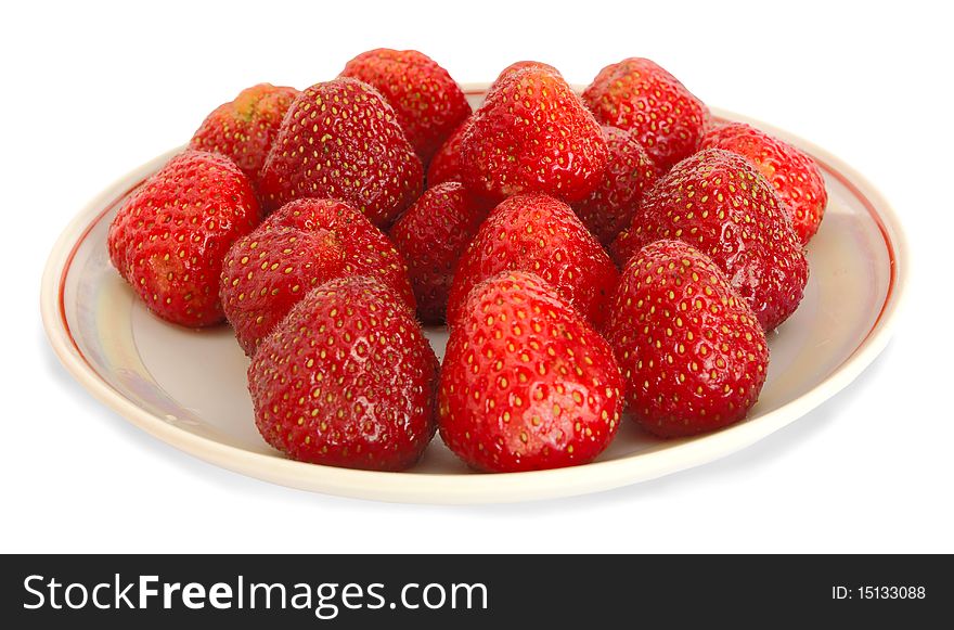Strawberry on a saucer on a white background