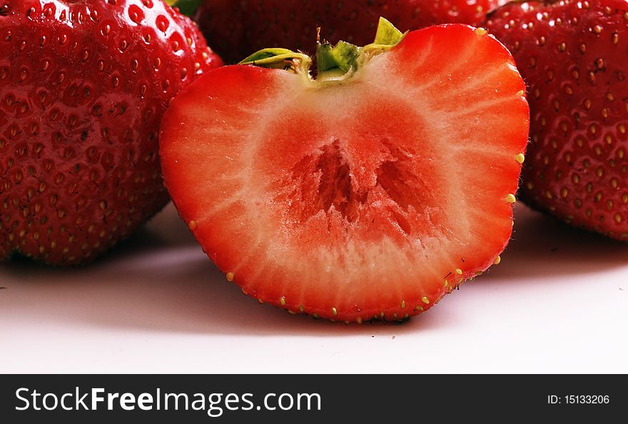Strawberries close-up show, isolated on white