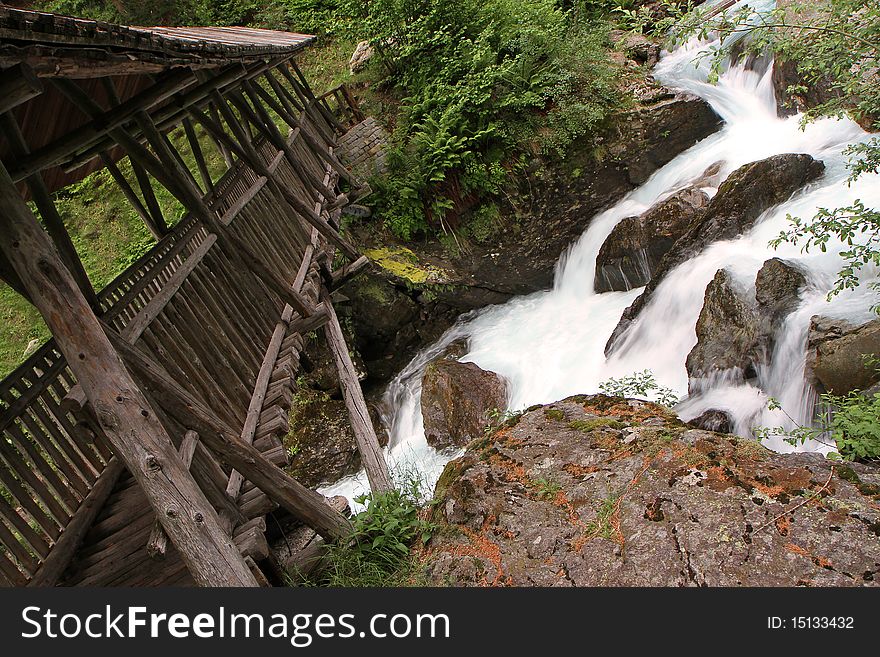 Wooden Bridge Along The Riverside