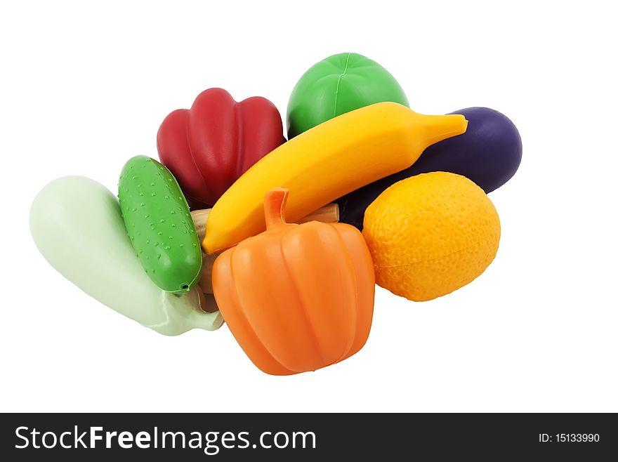 Fake vegetables and fruits isolated on white