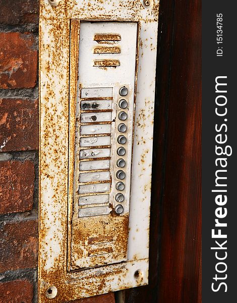 Old intercom in close up  on a brick wall