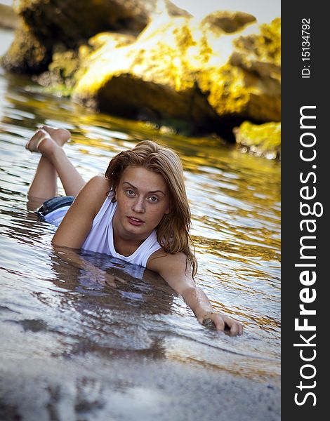 girl in the sea in a white t-shirt. girl in the sea in a white t-shirt