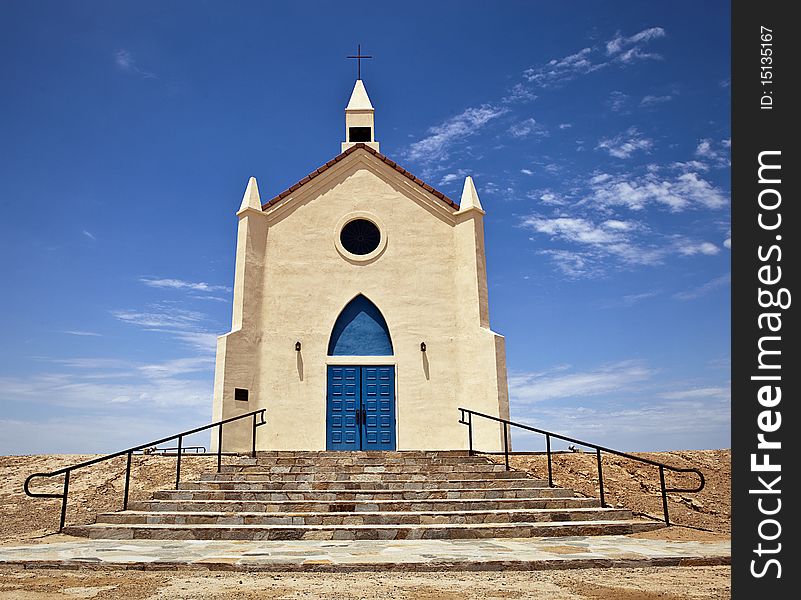 Small church with blue doors located in the desert. Small church with blue doors located in the desert