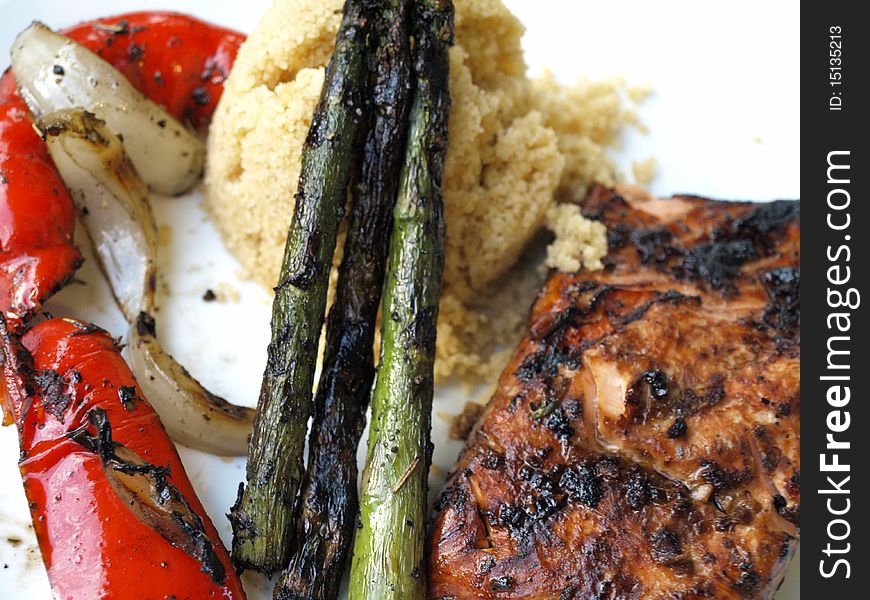 Salmon with fresh asparagus, couscous  and red peppers. Salmon with fresh asparagus, couscous  and red peppers.