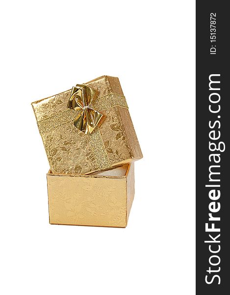 Golden gift box with a bow on white background. Isolated with path