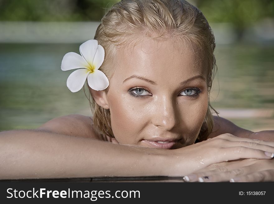 Portrait of young attractive woman having good time swimming pool. Portrait of young attractive woman having good time swimming pool