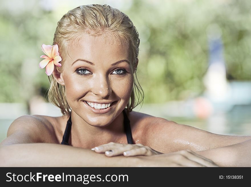 Portrait of young attractive woman having good time swimming pool. Portrait of young attractive woman having good time swimming pool