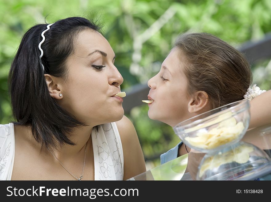 Portrait of young woman having good time with her daughter. Portrait of young woman having good time with her daughter