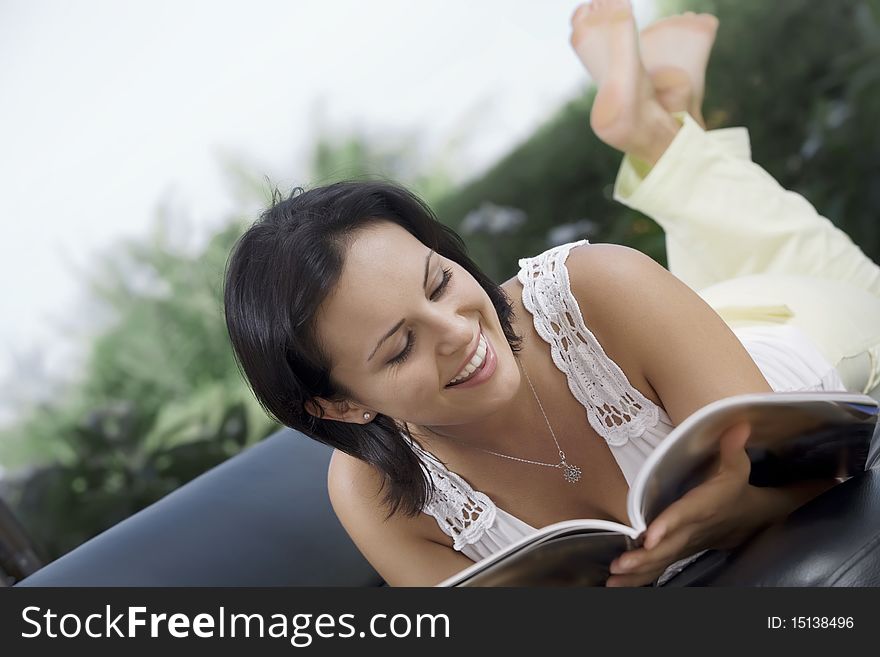 Portrait of woman with laptopm in summer environment. Portrait of woman with laptopm in summer environment