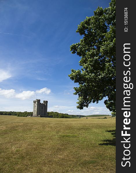 Blue skies over green fields and castle building in Arundel, Sussex. Blue skies over green fields and castle building in Arundel, Sussex