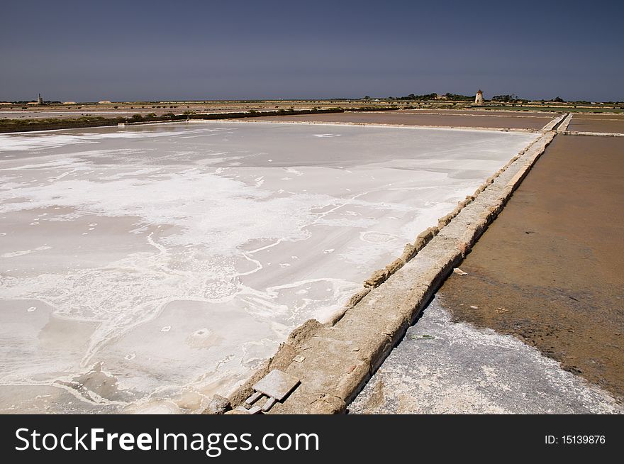 Windmills and salt marshes at Infersa Salt Pans, Marsala, Sicily, Italy