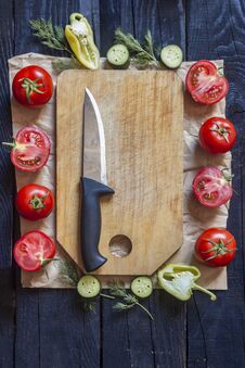 Salad Ingredients. Fresh Raw Vegetables On Wood. Healthy Cooking Salad. Cutting Board With A Kitchen Knife Royalty Free Stock Photo