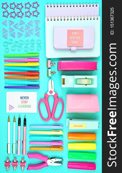 Back to school or workspace colorful stationery overhead flatlay.