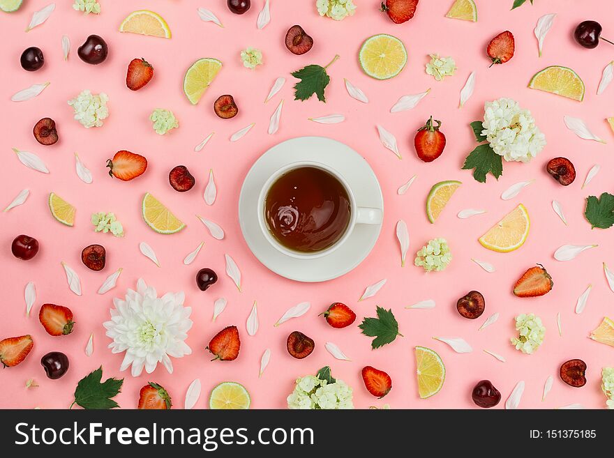 Flatlay With Various Fruits, Berries, Flowers And Cup Of Tea