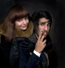 Portrait Of Young Man And Young Women With Cigar Stock Photo
