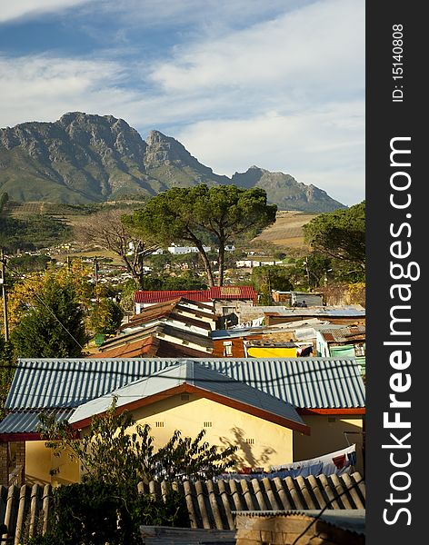 The roofs of various houses in a township in Stellenbosch, in South Africa. The roofs of various houses in a township in Stellenbosch, in South Africa
