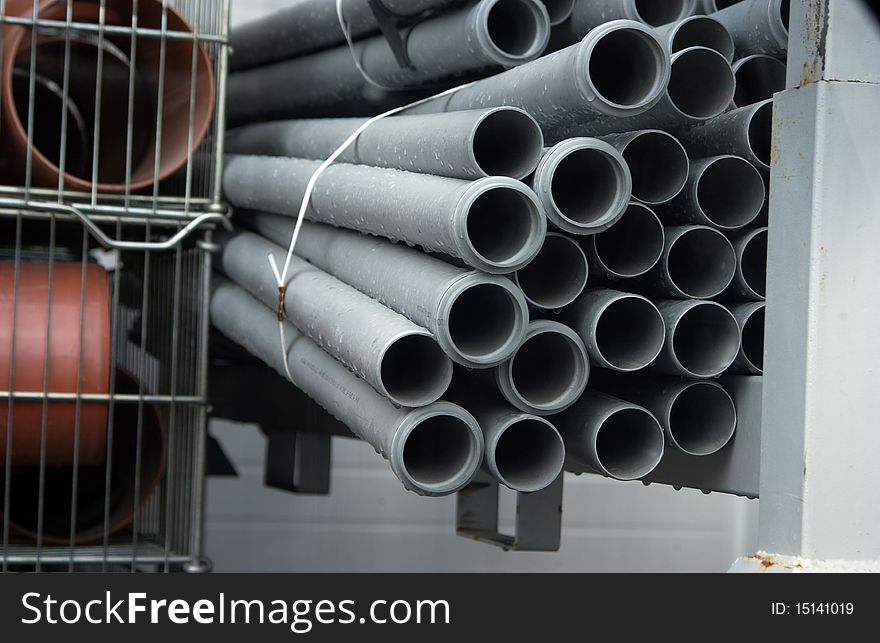 Stack of draining pipes in a store