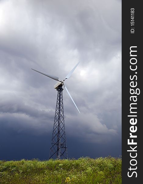 A picture of wind power turbine with beautiful sky background