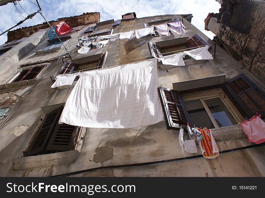 Washing hanging from the windows and lines in a small Istrian Old Town. Washing hanging from the windows and lines in a small Istrian Old Town