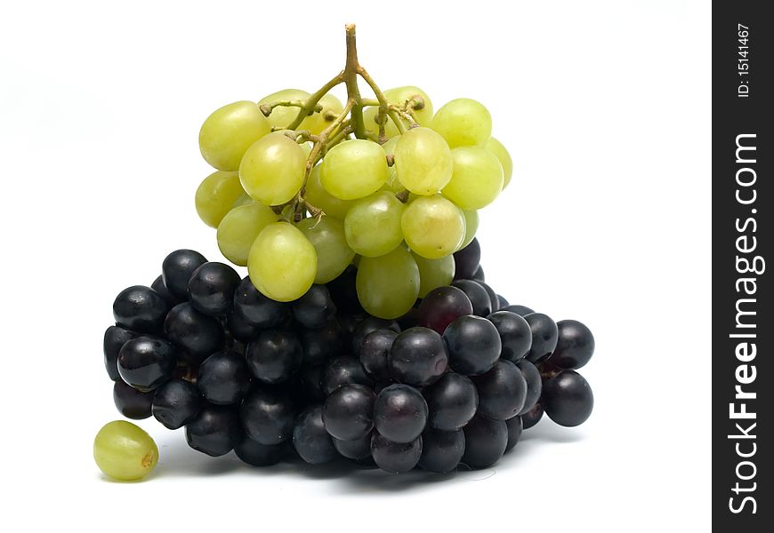 Bunch of green and black grapes isolated on white