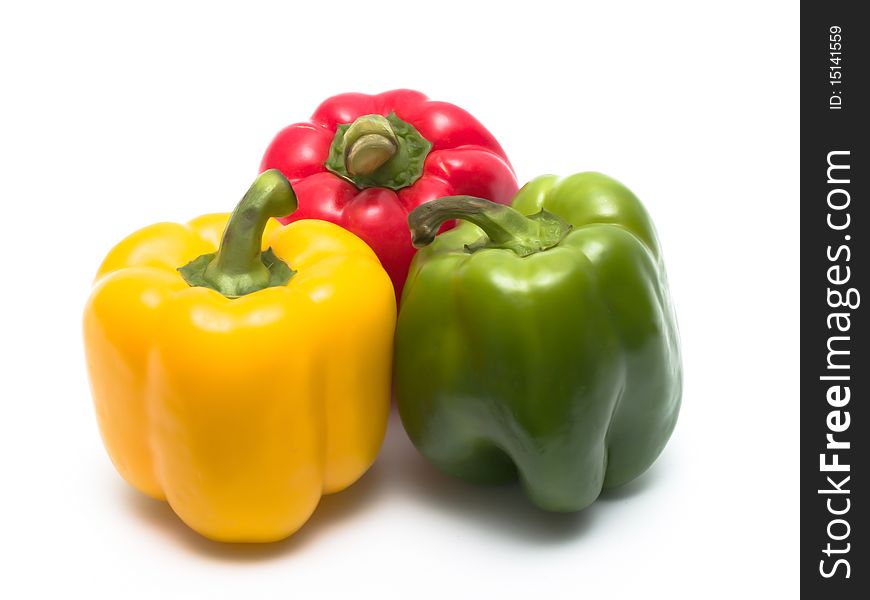 Peppers of different colors isolated on white