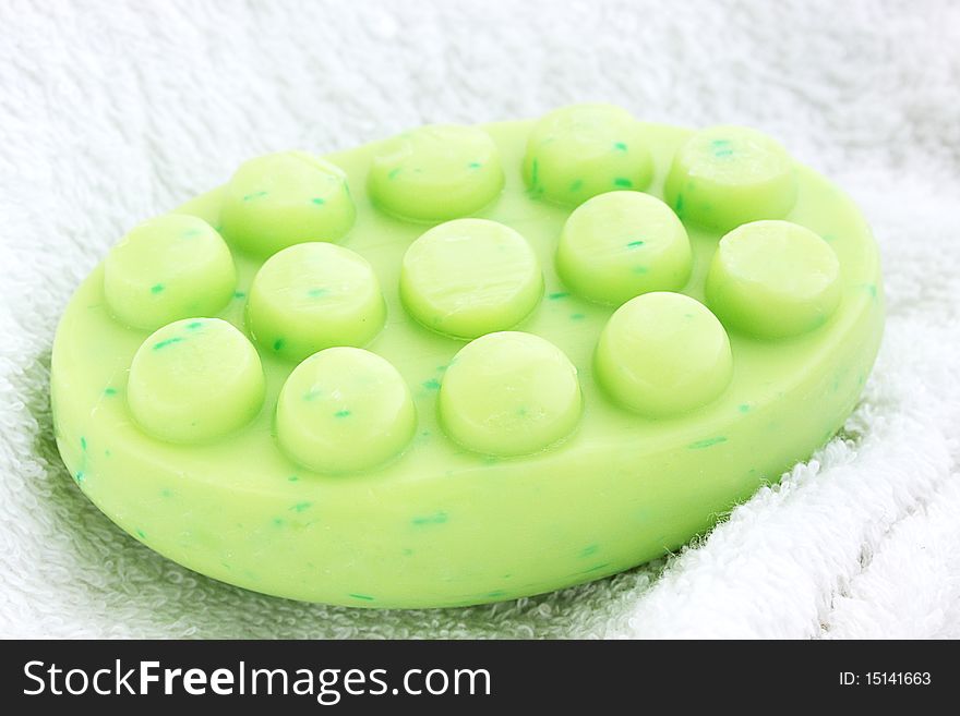 Green anticellulite soap on the white towel