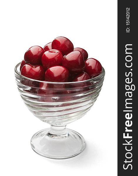 Cherries in a bowl isolated on a white