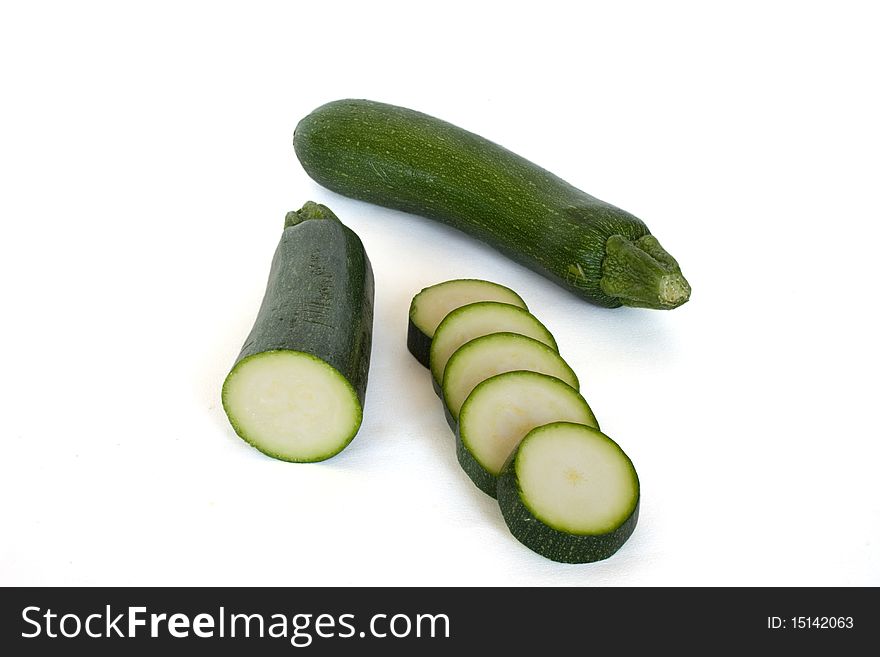 Zucchini whole and sliced in isolated over white. Zucchini whole and sliced in isolated over white